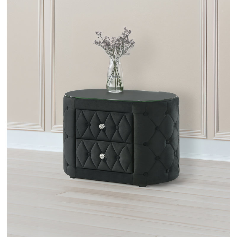 Table de chevet ovale luxueuse avec capitonnage moelleux, plateau en verre trempé, côtés arrondis, tiroirs de rangement et boutons scintillants pour la chambre à coucher