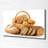 Bread In A Basket - Wrapped Canvas Print