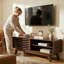 Meuble télé avec porte coulissante à lattes, console multimédia pour le salon