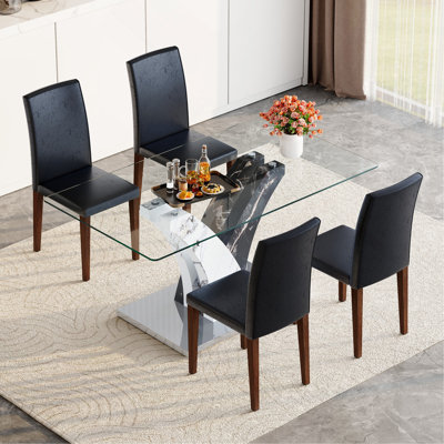 Ensemble de table et de chaises. Table de salle à manger moderne, comptoir en verre trempé et pieds en panneau de fibres à densité moyenne artistiques, jumelés à 4 chaises simples et polyvalentes, confortables et accompagnées.