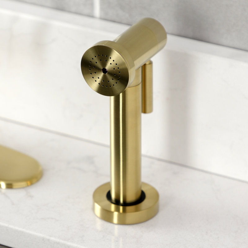 Kingston Brass Whitaker Single-Handle Deck Mount Kitchen Faucet with Brass Sprayer, Brushed Brass