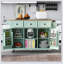 Chariot de cuisine avec comptoir à abattants en bois d'hévéa, porte d'armoire, supports de rangement internes et 5 roulettes pour faciliter le déplacement et l'organisation