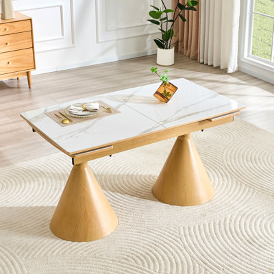 Extendable Stone-Top Dining Table: White marble-patterned tabletop with wood-colored tapered metal legs. A modern, luxury-inspired rectangular dining