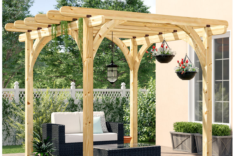 freestanding wooden pergola with hanging flower baskets over a wicker patio sofa