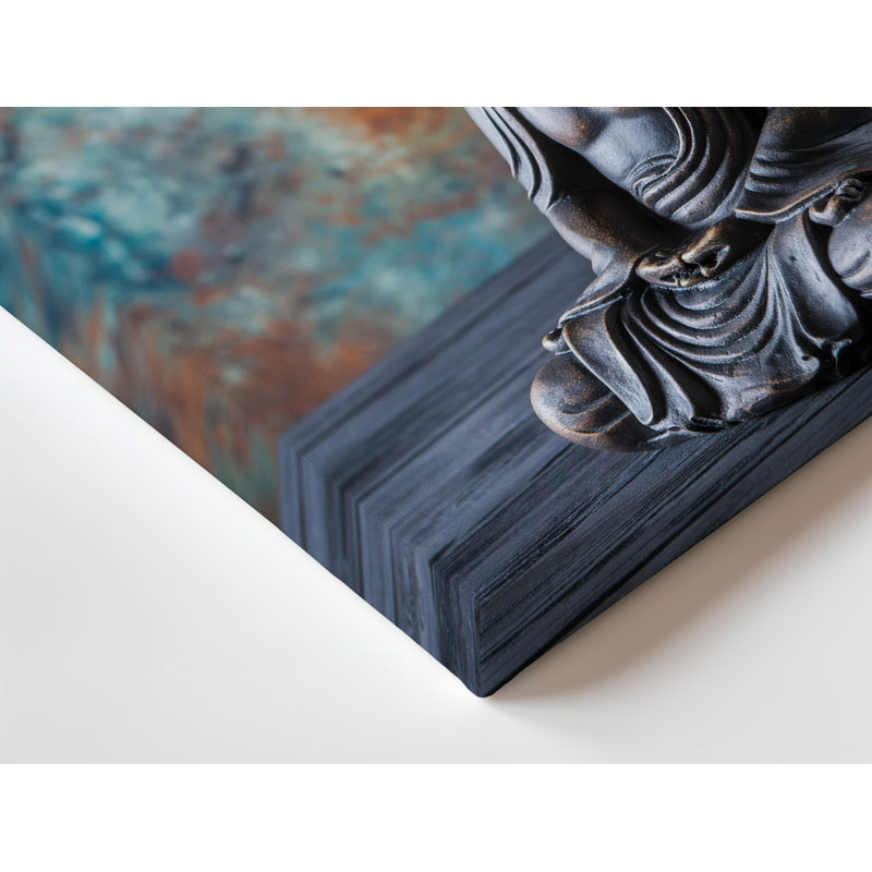 Toile, statue de Bouddha sereine posée dans une pose méditative sur un art mural, une table texturée en bois foncé entourée de branches délicates
