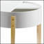 Table de bout ronde Bodfish blanche et naturelle, polyvalente et élégante pour un décor moderne et rustique, conception peu encombrante avec rangement fonctionnel.