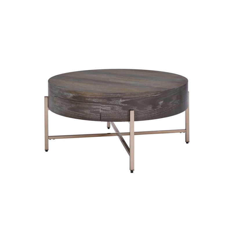 Table basse à tambour Weyton & Champagne avec tiroir de rangement et compartiment ouvert, parfaite pour les salons modernes.