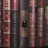 Advik Faux Leather Circular Storage 2 Door Red Cabinet with Stacked Book Design and Scroll Details