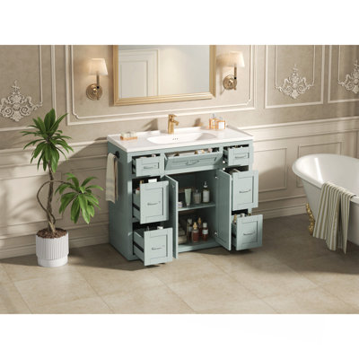 Meuble-lavabo 48 po vert menthe avec lavabo en céramique - 6 tiroirs (3 de chaque côté), tiroir central rabattable, portes doubles à fermeture en douceur, porte-serviettes réversible, poignées argentées, panneau de fibres à densité moyenne