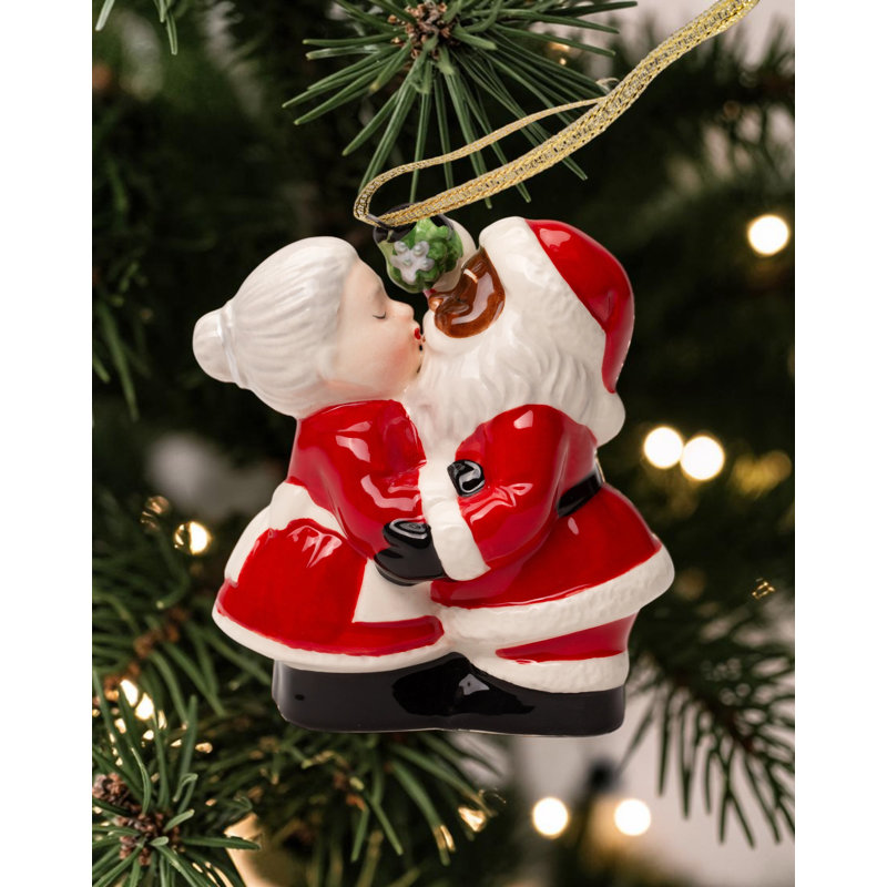 Kissing Santa couple sel et poivre
