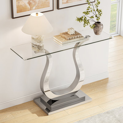 Console de 119 cm (46,85 po) avec plateau en verre, plateau rectangulaire moderne en verre trempé transparent et piètement incurvé en acier inoxydable poli, table d'entrée luxueuse