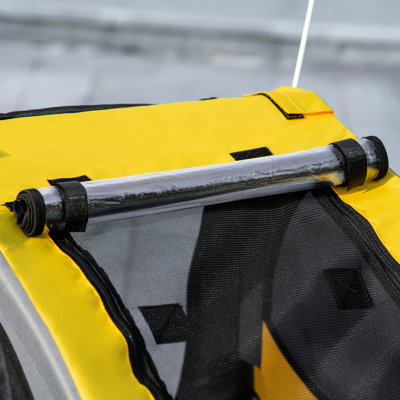 Chariot de voyage moyen pour chien - Remorque pour animal de compagnie. Fabrication en acier, filet de ventilation. Drapeau pour. Remorque de transporteur jaune, construction, confort et balisage