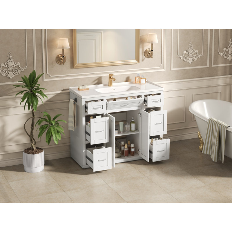 Meuble-lavabo blanc 48 po avec lavabo en céramique - 6 tiroirs (3 de chaque côté), tiroir central rabattable, portes doubles à fermeture en douceur, porte-serviettes latéral réversible, poignées argentées, panneau de fibres à densité moyenne