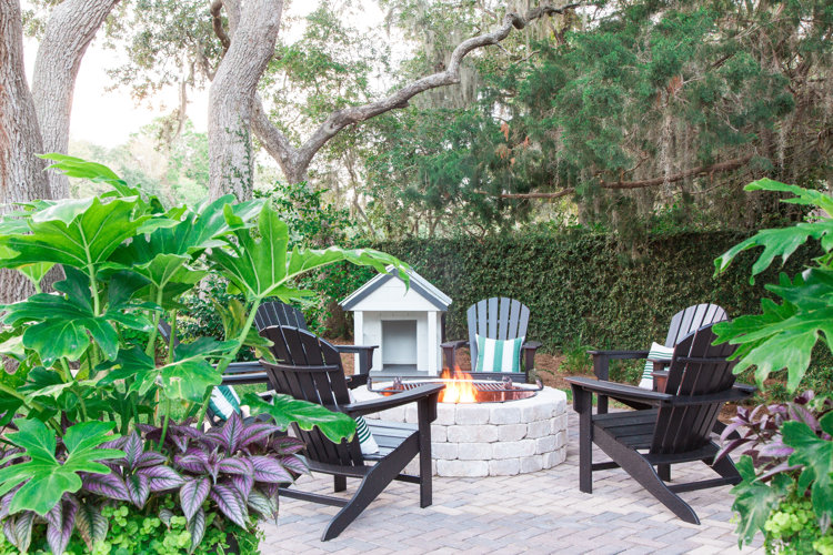 adirondack chairs around a firepit