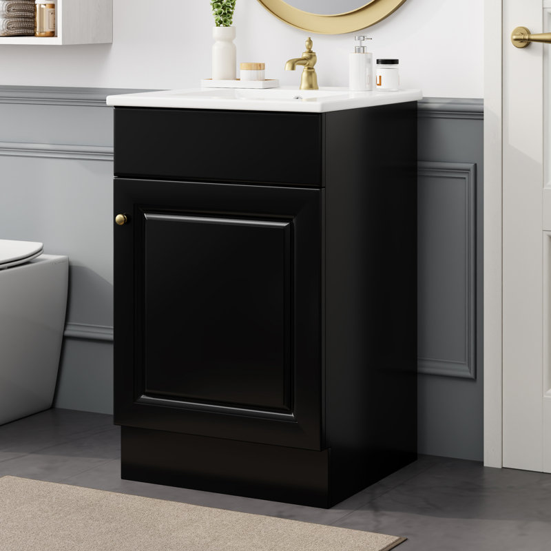 Meuble-lavabo noir de 50 cm avec vasque. Armoire à panneaux, tablette de porte et tablette intérieure réglable. Vasque en céramique lisse et imperméable. Vasque à charnières, noire. Armoire à utiliser. Revêtement teinté pour la vasque.