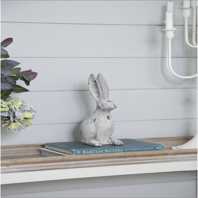 Statue de lapin en ciment patiné