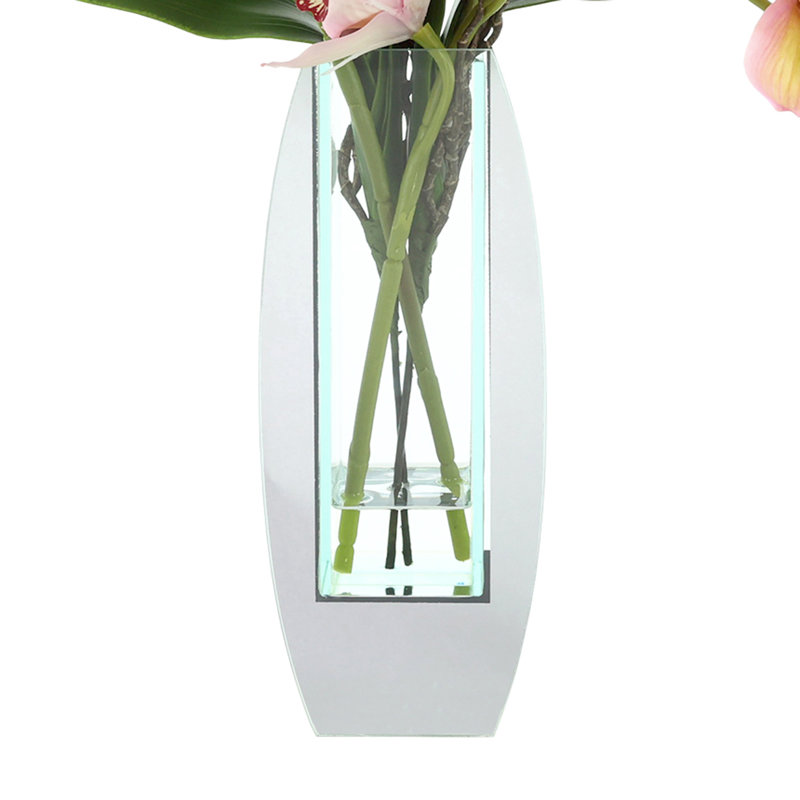 Arrangement d'orchidées dans un vase miroir, Rose