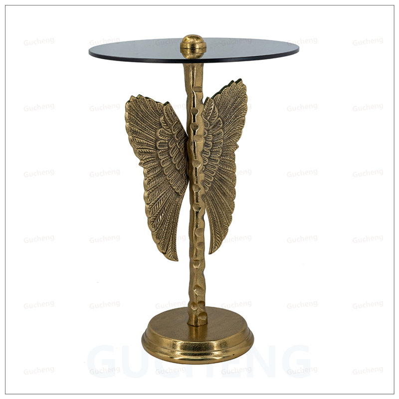 Table d'appoint à plateau rond avec aile d'ange, parfaite pour ajouter une touche d'élégance et de glamour à n'importe quelle pièce