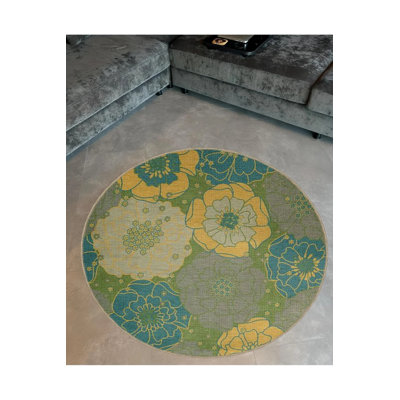 Tapis décoratif à motifs floraux dans des tons bleus et verts