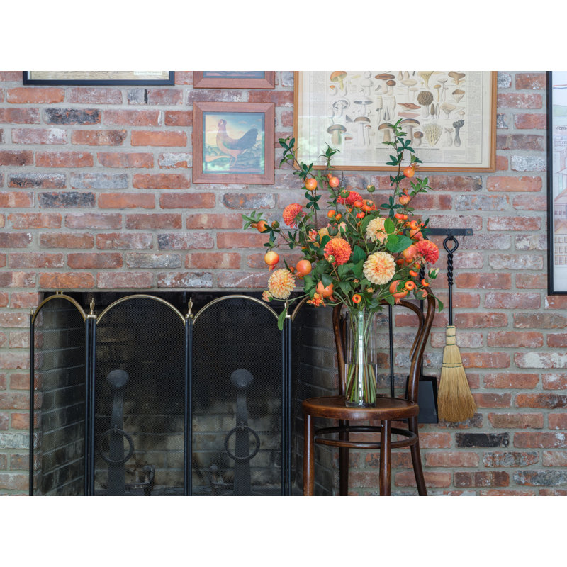Orange Dahlias and Pomegranate Branches in Tall Glass Vase