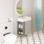 Meuble-lavabo à tablettes ouvertes avec lavabo en céramique et porte à fermeture en douceur, offrant beaucoup de rangement et un entretien facile pour une salle de bain fonctionnelle.-273199931