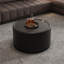 Table basse ronde ronde en forme de tambour avec plateau en verre trempé, corps en cuir de polyuréthane noir profond, rangement caché pour le salon, pièce décorative moderne