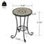 Table d'appoint de patio avec tablette en brun et noir. Surface en carreaux de céramique pour une utilisation durable. Pieds à volutes en acier noir. 14 po de diamètre. Assemblage requis. Table brune et noire. Conception délicate. Tablette.