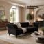 Canapé Chesterfield 3 places en velours capitonné, accoudoirs arrondis, pieds en bois sculpté, 225 cm de large, avec 2 coussins