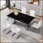 Table de salle à manger moderne et minimaliste avec verre imitation marbre noir, résistante à la chaleur et spacieuse pour des rassemblements élégants.