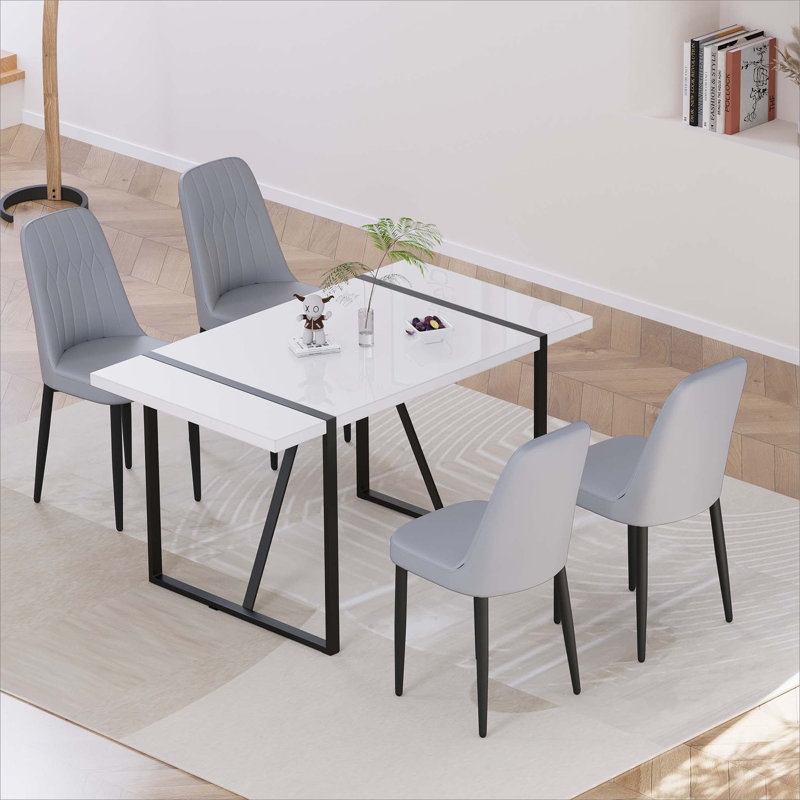 Ensemble de table de salle à manger moderne en MDF de 55 po pour 4 personnes, ensemble de table et de chaises avec pieds en métal noir pour la cuisine, plateau de table rectangulaire blanc industriel et chaises de salle à manger rembourrées en polyuréthane épais