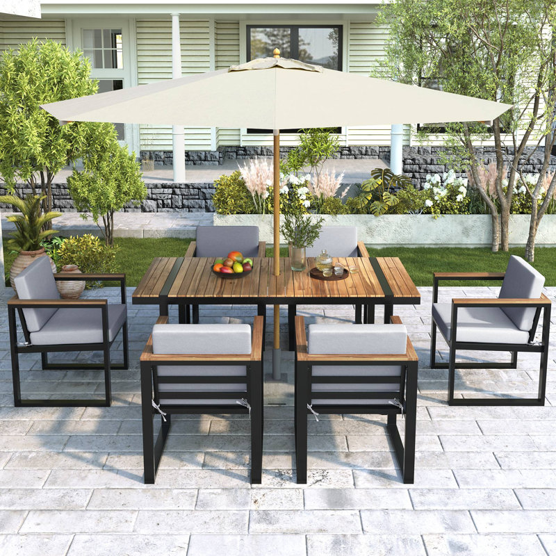Ensemble de salle à manger d'extérieur 7 pièces comprenant une table et des chaises avec coussins amovibles, idéal pour terrasse, jardin ou cour arrière.