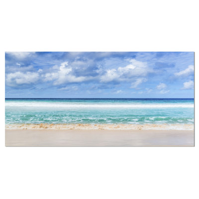" Tranquil Beach Under White Clouds "