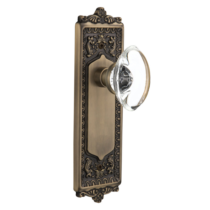 Egg & Dart Plate avec bouton de porte en cristal transparent, Laiton antique, 2 3/8 po