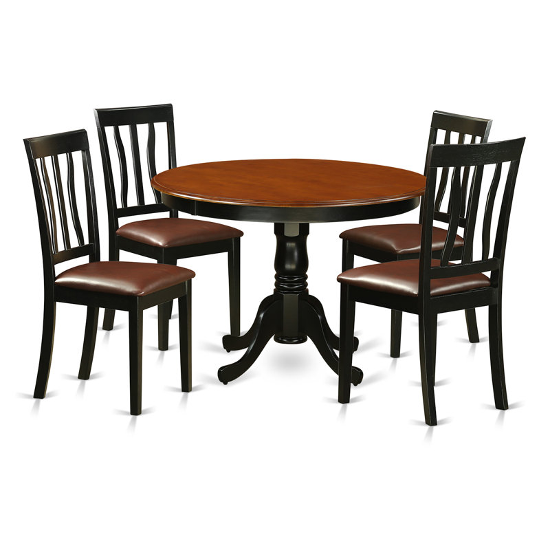 L'ensemble de salle à manger 5 pièces comprend une table ronde avec piédestal et 4 chaises de cuisine en similicuir, noir et cerise