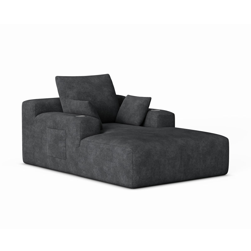 Grand canapé méridienne en velours côtelé noir, sans montage, avec assise large et profonde, porte-gobelets et poche de rangement latérale. Coussins décoratifs inclus. Parfait pour un appartement ou une résidence étudiante.