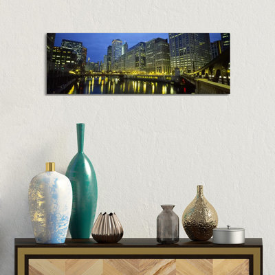Low Angle View Of Buildings Lit Up At Night, Chicago River, Chicago, Illinois, USA by Panoramic Images - Wrapped Canvas Panoramic Print
