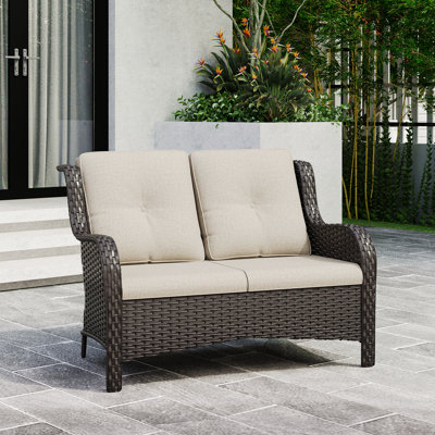 Meikel 49" Wide Outdoor Wicker Reversible Loveseat with Cushions by Winston Porter