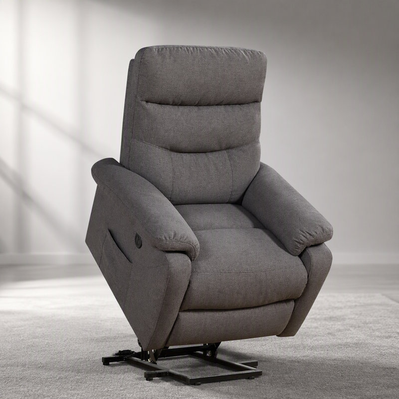 Fauteuil releveur contemporain avec revêtement en tissu gris, fonction de relevage et inclinaison électriques pour un confort et une mobilité optimaux.