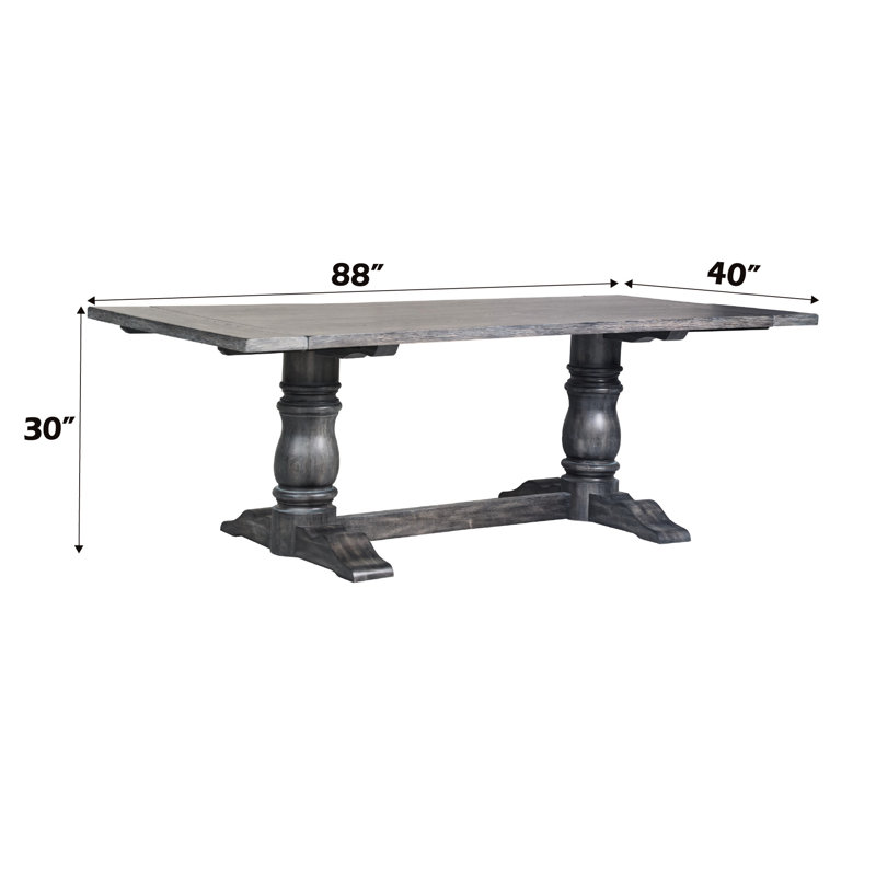 Table de salle à manger grise patinée avec plateau rectangulaire en bois massif et pieds doubles en bois