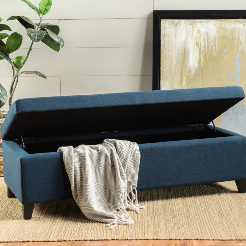 : Rangement spacieux en tissu bleu marine et pieds en bouleau avec toile de bois