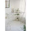 Console de 109 x 42 x 86 cm avec perchoir pour oiseau en fer vieilli, pieds torsadés, aspect blanc patiné. Un élément décoratif fantaisiste pour une entrée ou un couloir.