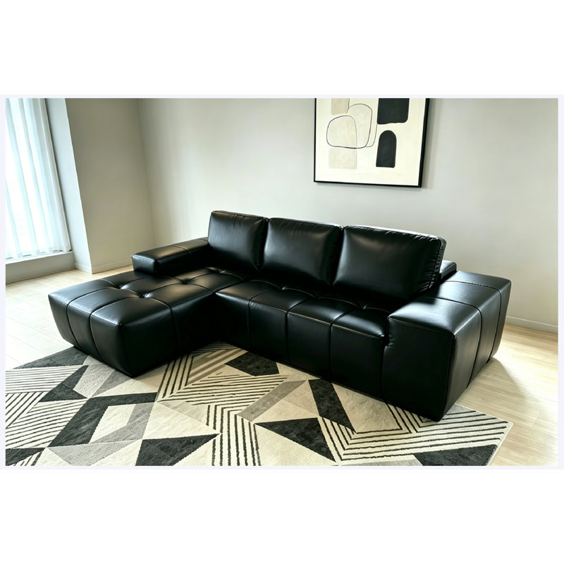 Canapé d'angle modulaire Cloud en similicuir noir, orientation gauche, avec méridienne et assise profonde.