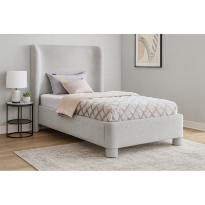 Hridhaan Upholstered Unfinished Wingback Bed
