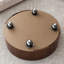 Table basse ronde avec 2 tiroirs à fermeture douce, plateau en pierre frittée imitation marbre et piètement en placage de noyer