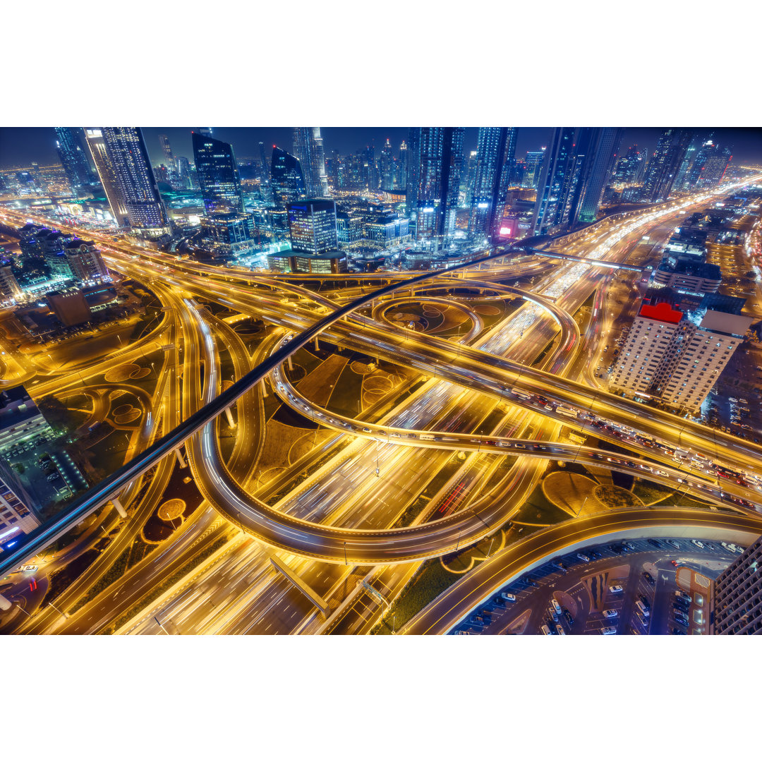 Aerial View Of Big Highway Interchange With Traffic In Dubai, UAE, At Night by Britus - Wrapped Canvas Print
