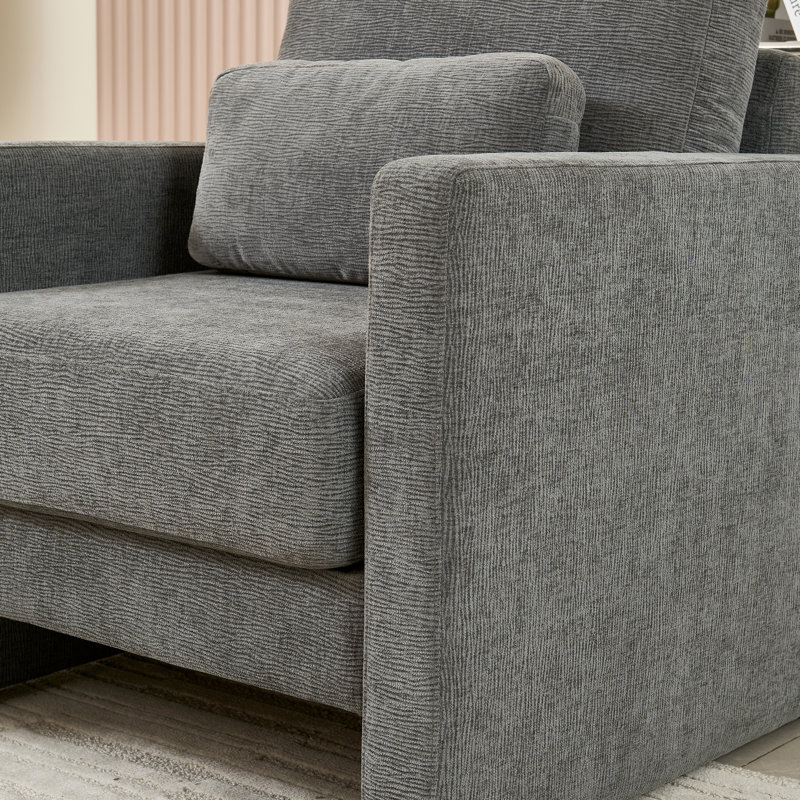 Le fauteuil Classy Modern en chenille avec base en bois massif assure une position assise confortable dans diverses pièces.