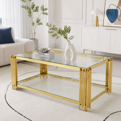 Table basse moderne en verre transparent avec cadre métallique asymétrique
