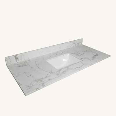 Comptoir de salle de bain en pierre avec lavabo rectangulaire encastré en céramique, trou de robinet et dosseret
