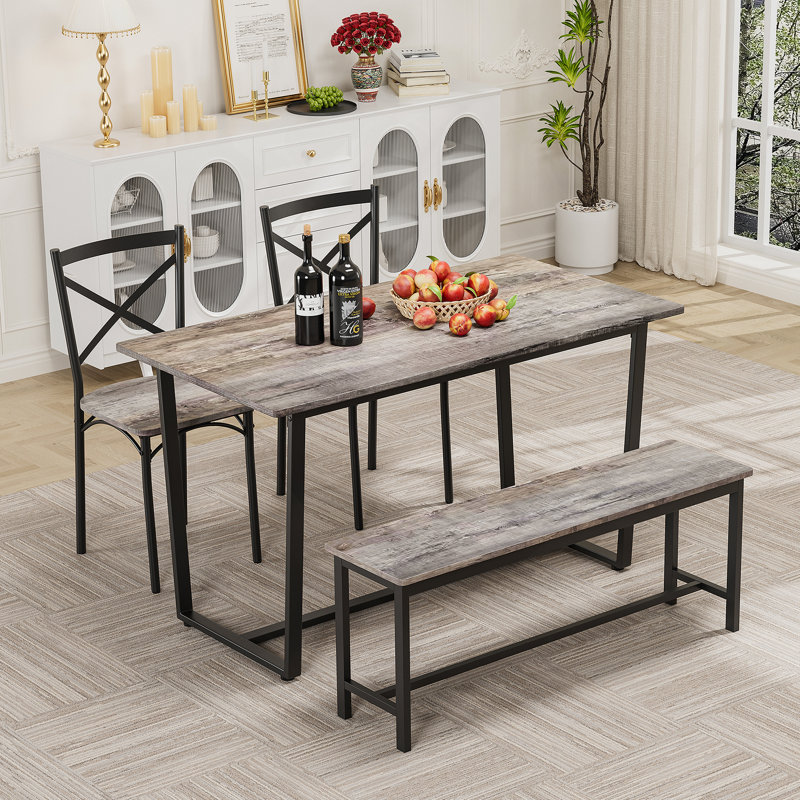Ensemble de table et de chaises de style industriel quatre pièces avec dossier, structure solide pour des espaces de salle à manger polyvalents