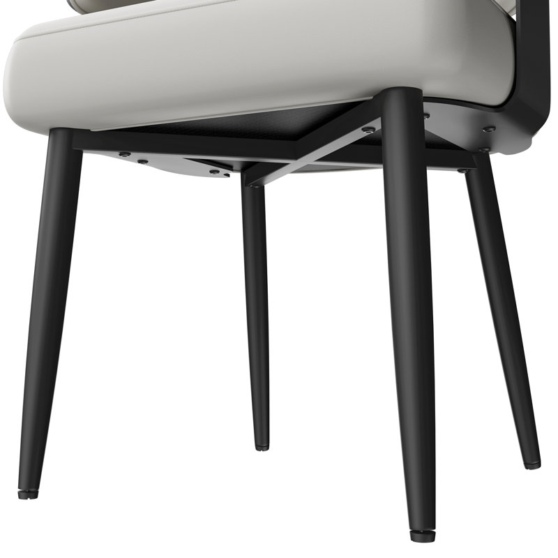 Chaise de salle à manger moderne rembourrée, hauteur du siège de 47 cm (18,5 pouces), dossier enveloppant incurvé, assise épaisse et pieds en métal noir.